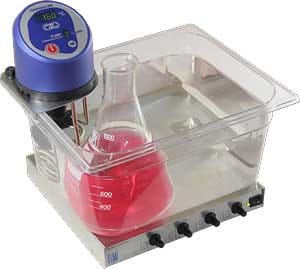 TW-2.03 Heated Clear Plastic Water Bath, sitting on an Elmi Four Position MS-01 Magnetic Stirrer 
